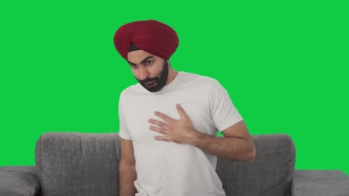 Sick Sikh Indian man having a Heart attack Green screen