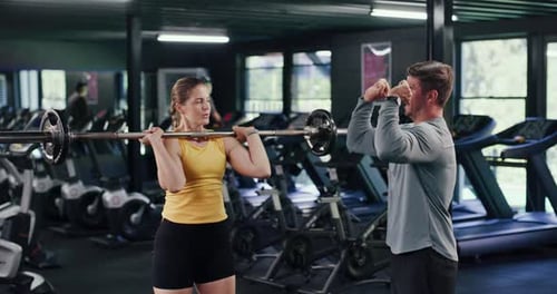 Barbell, personal trainer and fitness with woman in gym for weightlifting