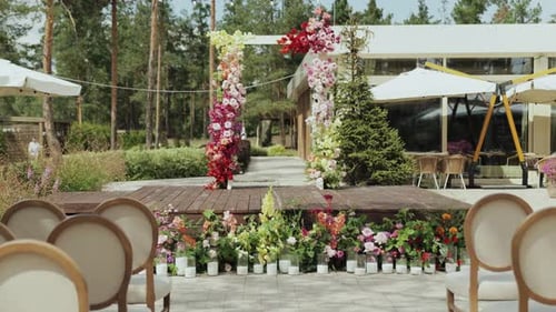Decorated Wedding Venue with Flowers and Elegant Chairs