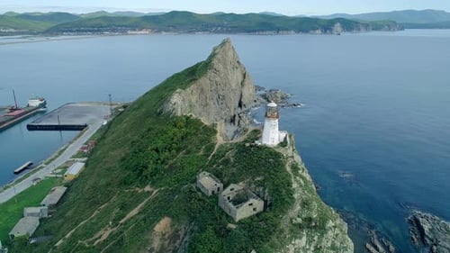 Aerial Orbital View of an Old Lighthouse on the Cliff on Pacific Coast Beautiful Panoramic Seascape