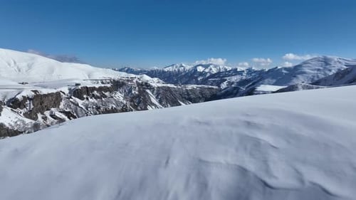 Aerial view of beautiful snowy mountains in Gudauri, Georgia