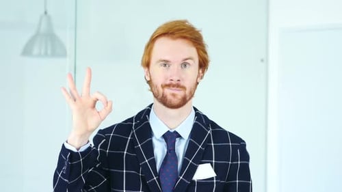 Okay Sign By Beard Redhead Businessman in Office