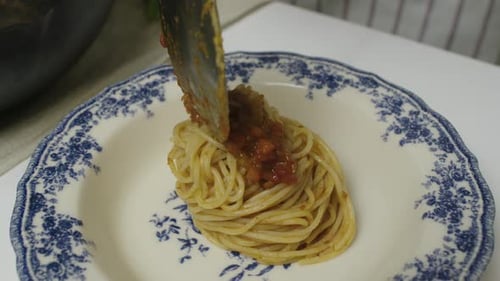 Spaghetti on a Plate with Sauce Close Up