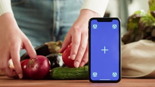 Food Shopping Delivery Online Shop Application Smartphone with Blue Chroma Key Screen and Fresh