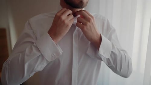 Man Buttons White Dress Shirt for Formal Event