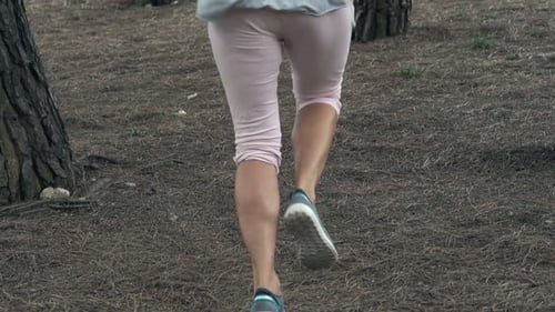 Woman Jogging In Park