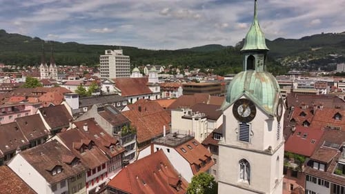Aerial view of Olten, Switzerland, showcasing the town's red-tiled rooftops, historic buildings