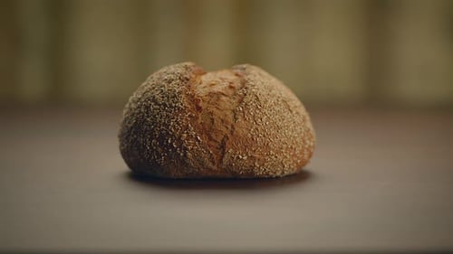 Round Dark Bread Loaf Zooming Out