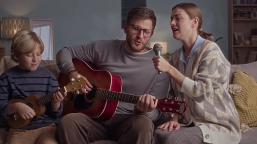 Family sings and plays music together at home
