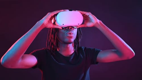 Man Uses VR Headset in a Dark Room