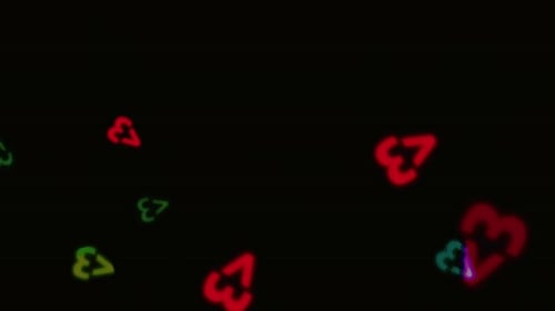 La colorida forma de amor de neón sobre fondo negro.