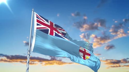 Waving Fiji Flag Against Blue Sky with Clouds