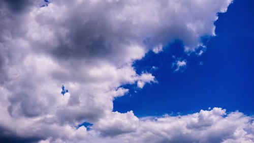 Cumulus Clouds Move in the Blue Sky Timelapse
