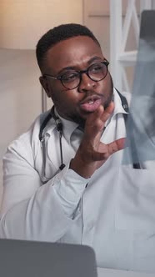Doctor Analyzing Chest X-Ray in Clinic