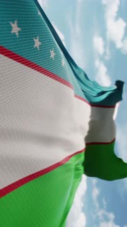Uzbekistan Flag Waving Against Blue Sky Vertical Video Loop
