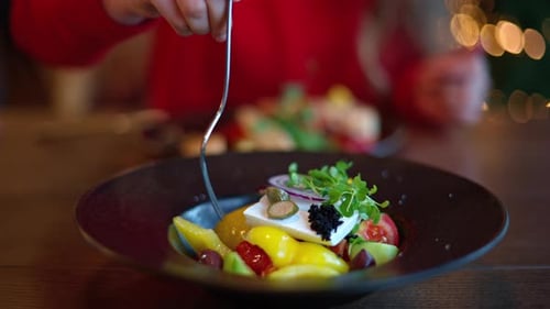 Greek Salad with Feta Being Eaten