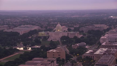 United States capitol building gleams at sunrise in Washington dc aerial view