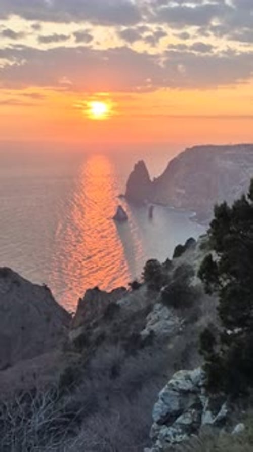 Sunset Ocean Cliffs Serene Natural Beauty Over Rocky Coastline at Dusk Tranquil Waters Reflect