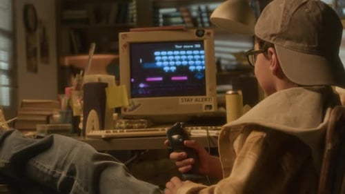 Boy Playing Videogame using Joystick