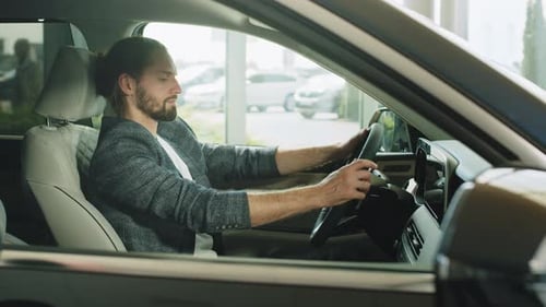 Confident Handsome Man Buying a New Car at the Dealership Presentable Happy