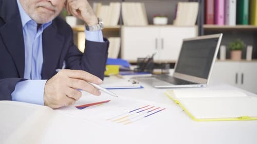 Adult Reviews Data Charts in Office Workplace