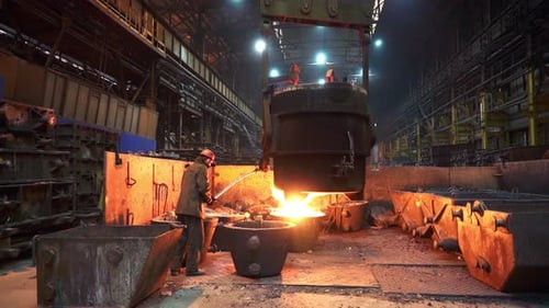 The Process of Molten Metal Casting Takes Place in an Industrial Foundry Setting Stock Clip