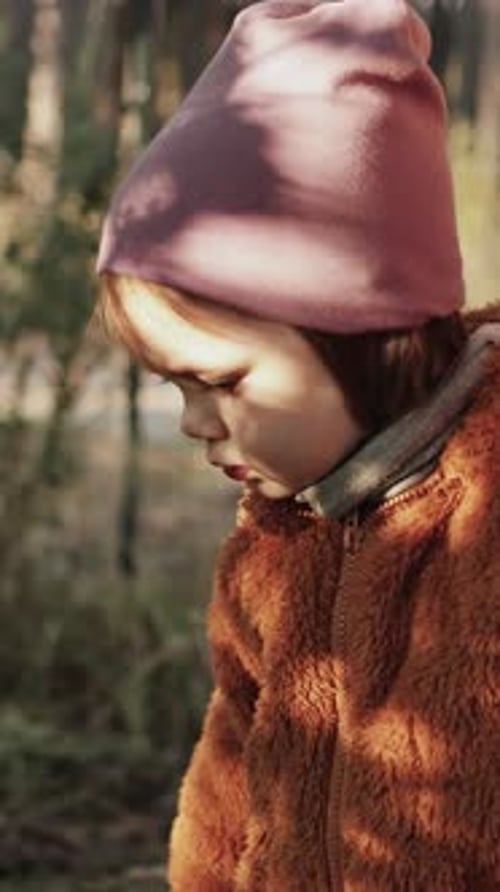 Vertical Video A Happy Toddler Walk with Her Mother Enjoying the the Sun in Autumn Forest Slow