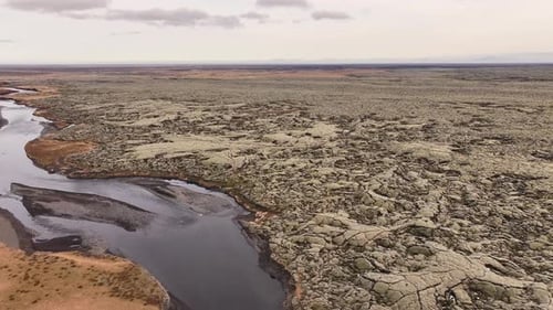 Iceland lava fields aerial - cracked volcanic landscape, river flow, Kirkjubæjarklaustur scenic dron