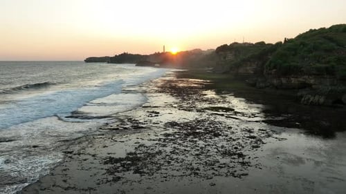 Aerial View of Coastal Cliff and Sea at Sunset