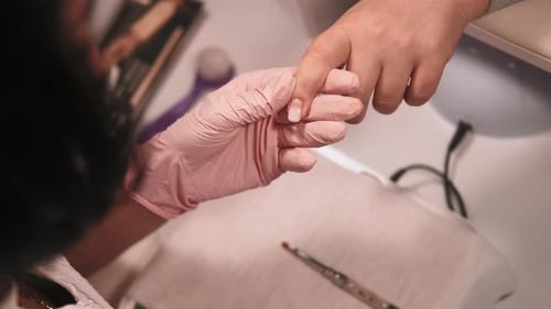 Applying Nail Polish at Manicure in Salon