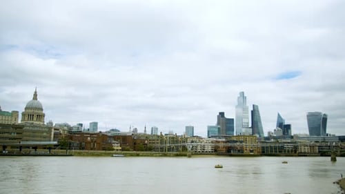 London Thames with st Paul's cathedral and other skyscrapers in the background central London time-l