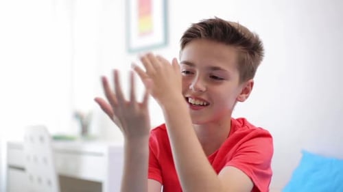 Happy Teen Boy Talking and Gesturing Indoors