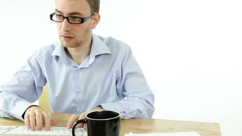 Man at Desk Gestures 'Call Me' to Camera