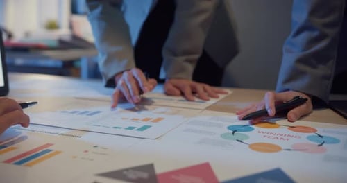 Business Team Analyzing Financial Charts and Reports