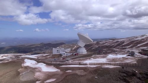 Radio telescope observatory in snowy mountains. Sierra Nevada. Spain.