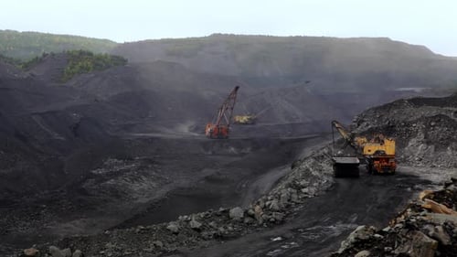 The Use of Heavy Machinery in OpenPit Mining Operations Involves Various Essential Activities Stock