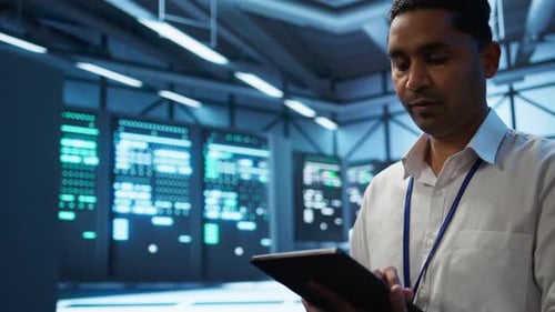 Man Using Tablet in Data Center