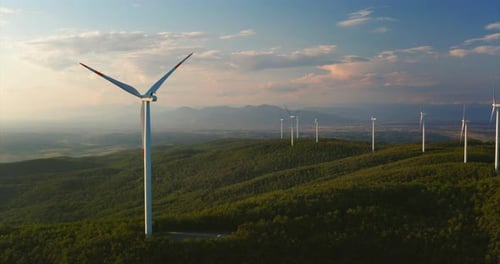 Aerial View of Wind Turbines on Rolling Hills