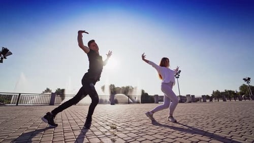 Dancing couple in the city.