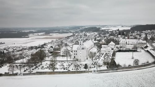 Widening Pullback Drone Snowy Church Cemetery