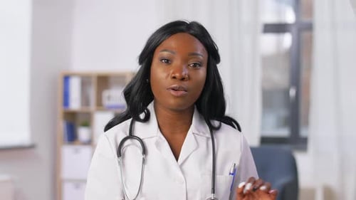 Medicine, Online Service and Healthcare Concept - African American Female Doctor Having