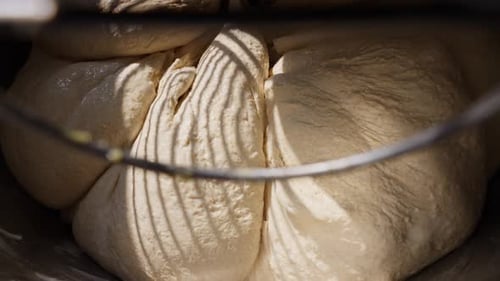 Bakery Dough Preparation Closeup Powerful Mixer Kneading Fresh Dough for Bread