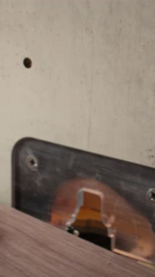 Vertical Video Machinist at Work Performing Tasks on Wood Shaper Close Up