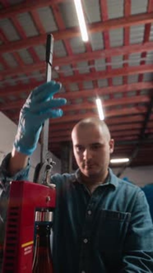 Young Adult Working on a Machine