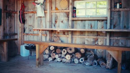 Inside Rustic Cabin with Wooden Benches