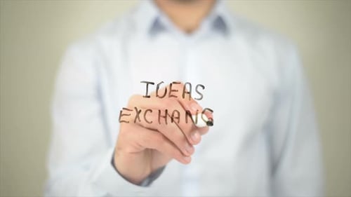 Ideas Exchange Man Writing on Transparent Screen