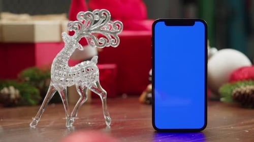 Phone with Green Screen Chroma Key Near Christmas New Year Background Vibes of Winter Holiday Glass