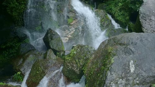 Waterfall Splashing on Rocks in Jungle Scenery, Small Waterfalls Landscape in Rugged Rocky Scene in