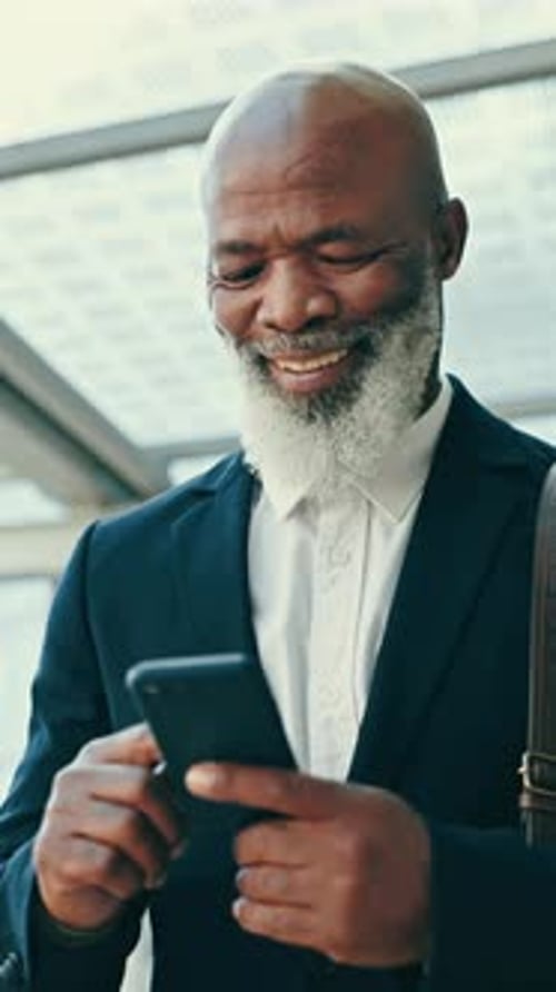 Businessman, reading and happy with phone or walking in office, building