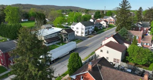 Historic homes and architecture in small town USA. American houses and blooming trees in spring dayt